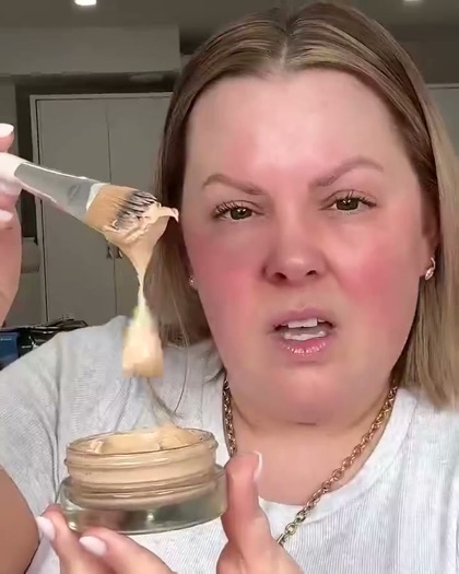 Creator applying foundation in a UGC video ad